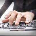 Closeup of a woman using computer.